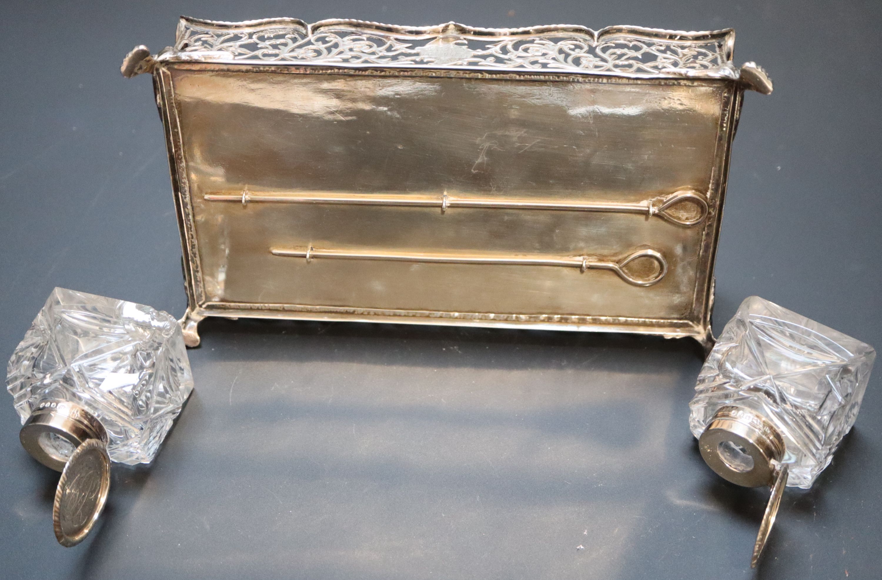 A Victorian silver rectangular inkstand with pierced gallery and two glass wells, Charles Stuart Harris, London, 1886/7, 18.7cm,